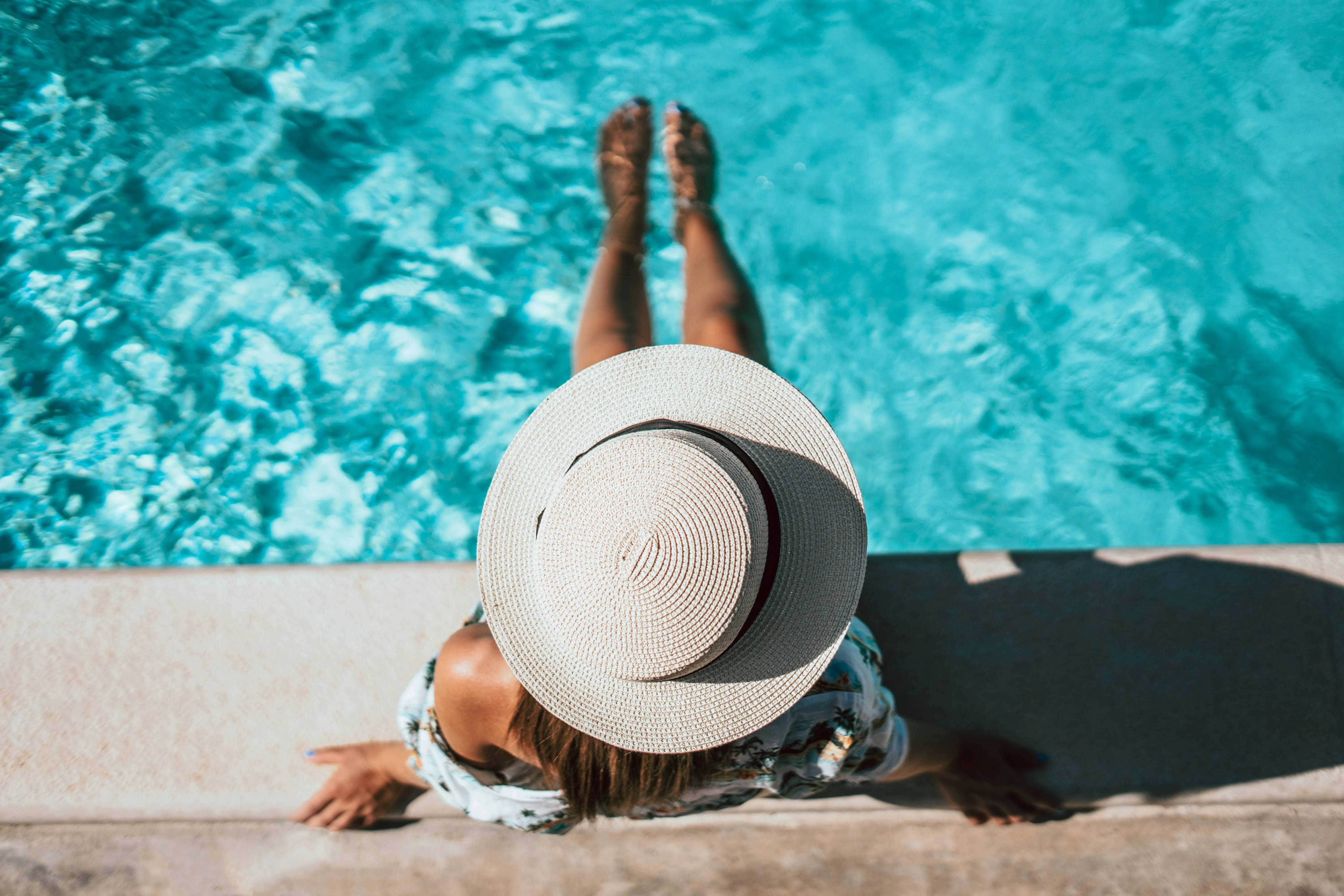 Woman relaxing by the pool